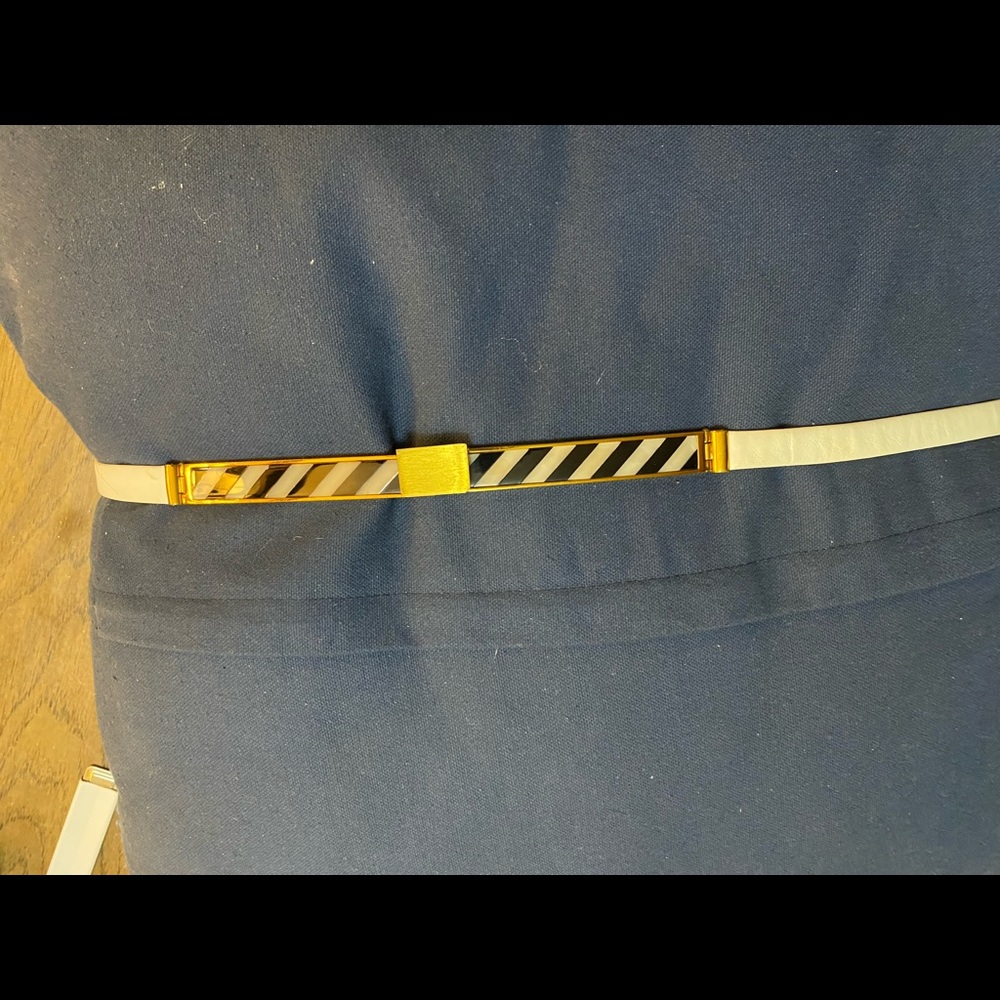 White Judith Lieber belt. Good condition. 36”. Stylish and very beautiful